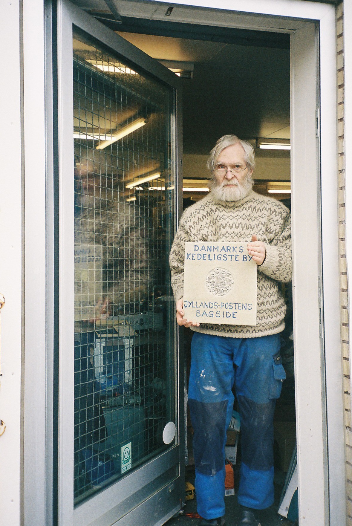 "Knud and his scavenged plaque from the soon-to-be-demolished Hørdum train station". Image by author (2024)